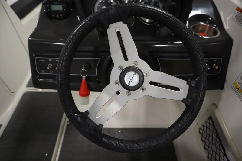 Slide: The Image of Steering wheel of 2021 Bayliner VR5 Bowrider OB boat, featuring sleek design and controls. - 19