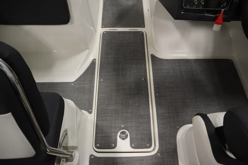 Slide: The Image of 2021 Bayliner VR5 Bowrider OB interior with gray flooring and seating. - 28