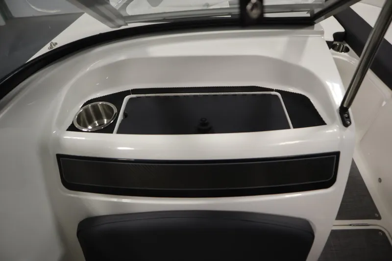 Slide: The Image of 2021 Bayliner VR5 Bowrider OB interior with cup holder and storage compartment. - 32