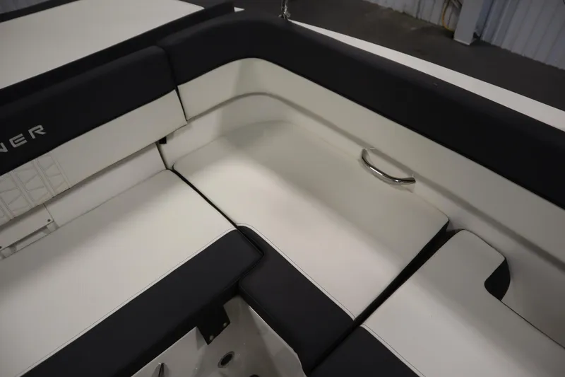 Slide: The Image of 2021 Bayliner VR5 Bowrider OB interior seating, featuring sleek black and white upholstery. - 38