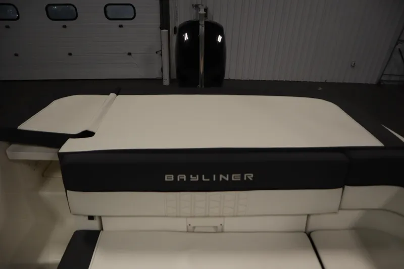 Slide: The Image of 2021 Bayliner VR5 Bowrider OB interior seating in a showroom setting. - 41