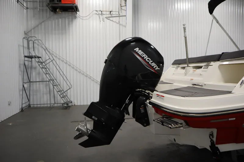 Slide: The Image of 2021 Bayliner VR5 Bowrider OB with Mercury outboard motor in a storage facility. - 45