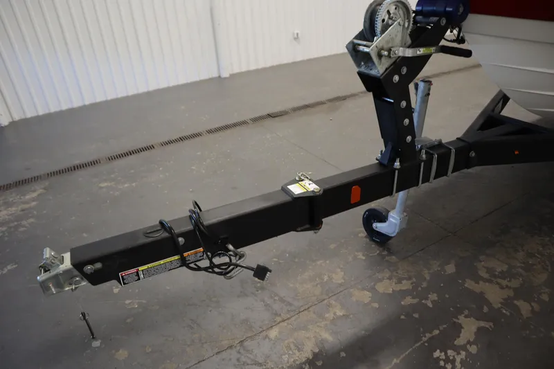 Slide: The Image of Trailer hitch of 2021 Bayliner VR5 Bowrider OB in a garage setting. - 48