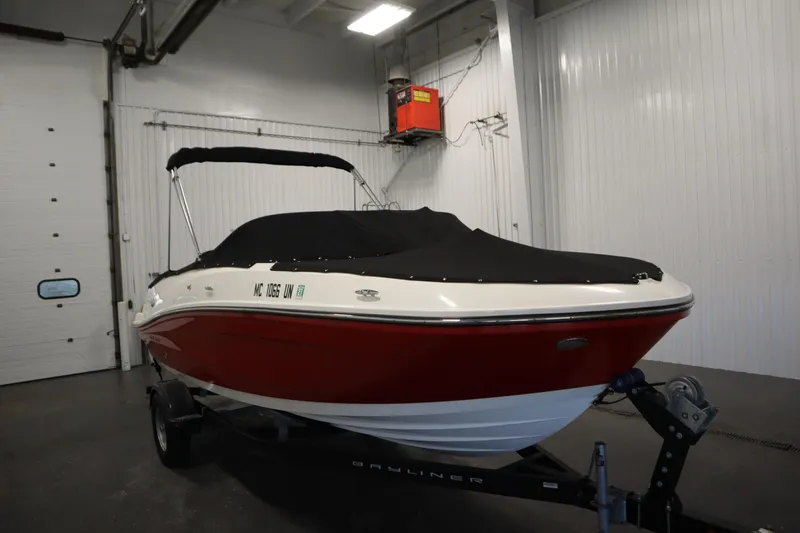 Slide: The Image of 2021 Bayliner VR5 Bowrider OB in storage, covered, on trailer. - 51