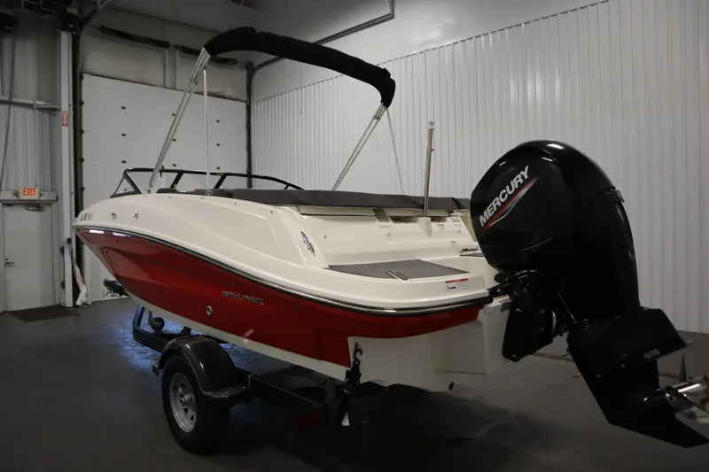Slide: The Image of 2021 Bayliner VR5 Bowrider OB with Mercury outboard in a garage setting. - 7