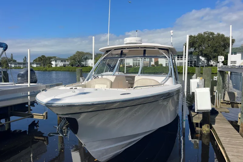 The Image of 2011 Grady-White Freedom 307 boat docked on a sunny day. - 0