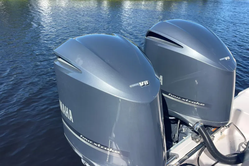 Slide: The Image of Twin Yamaha outboard engines on a 2011 Grady-White Freedom 307 boat. - 11