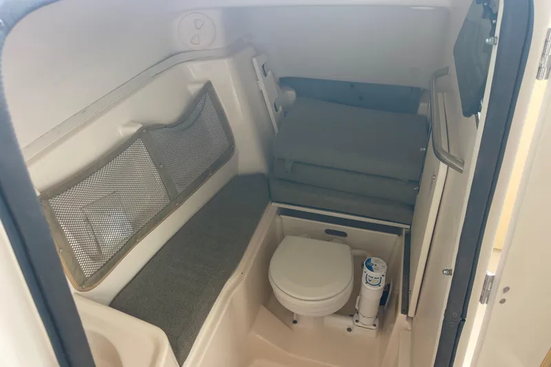 Slide: The Image of 2011 Grady-White Freedom 307 boat interior with compact bathroom amenities. - 16