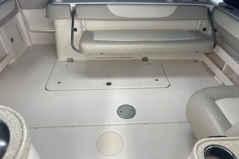 Slide: The Image of 2011 Grady-White Freedom 307 boat interior with seating and storage compartments. - 17