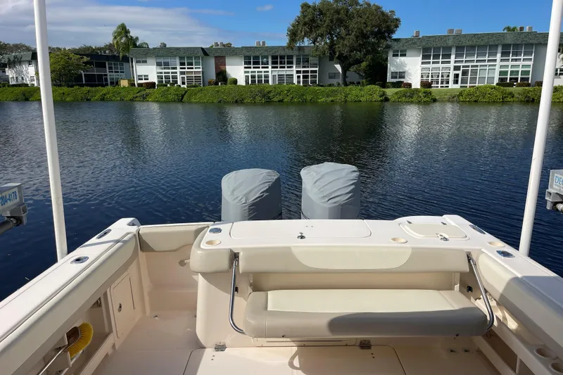 Slide: The Image of 2011 Grady-White Freedom 307 boat interior with seating and helm station. - 5