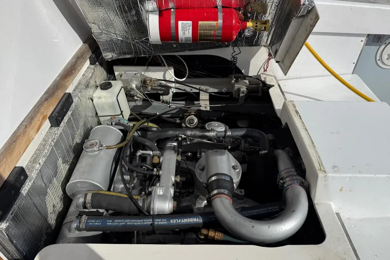 Slide: The Image of Engine compartment of a 1963 Bertram 31 Flybridge Cruiser with visible fire extinguisher. - 24