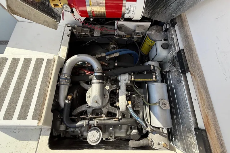 Slide: The Image of Engine compartment of a 1963 Bertram 31 Flybridge Cruiser, showcasing mechanical components. - 25