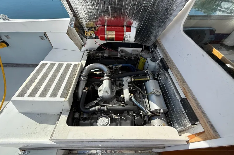 Slide: The Image of Engine compartment of a 1963 Bertram 31 Flybridge Cruiser with visible fire extinguisher. - 27
