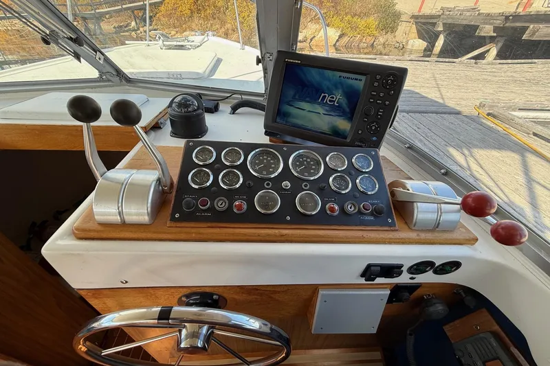 Slide: The Image of Control panel of a 1963 Bertram 31 Flybridge Cruiser with navigation equipment. - 34