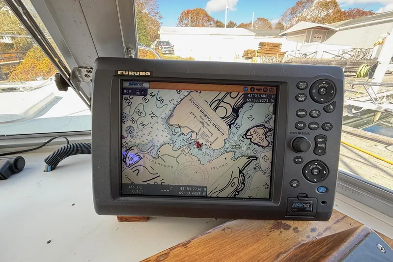 Slide: The Image of Navigation system on a 1963 Bertram 31 Flybridge Cruiser displaying a nautical chart. - 35