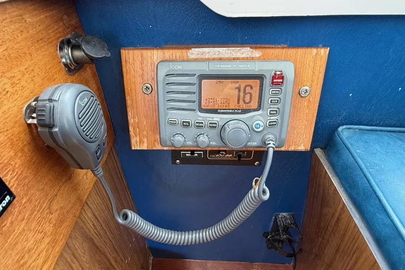 Slide: The Image of VHF marine radio on 1963 Bertram 31 Flybridge Cruiser, mounted on wooden panel. - 36