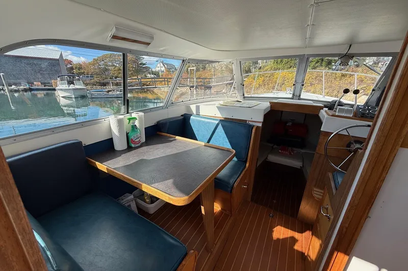Slide: The Image of Interior of a 1963 Bertram 31 Flybridge Cruiser with seating and helm. - 39