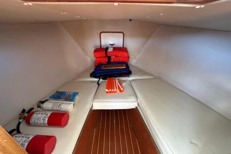 Slide: The Image of Interior of 1963 Bertram 31 Flybridge Cruiser with safety equipment and fire extinguishers. - 43