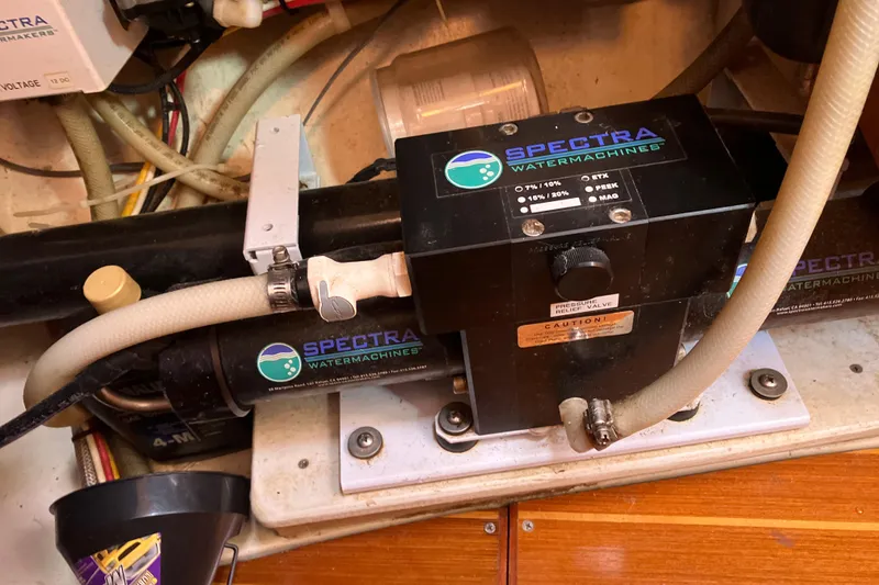 Slide: The Image of Spectra watermaker system in a 2002 Hunter 460 yacht engine room. - 12
