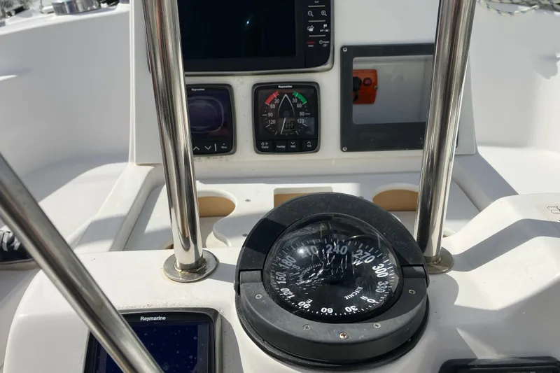 Slide: The Image of Cockpit of 2002 Hunter 460 sailboat with compass and navigation instruments. - 13