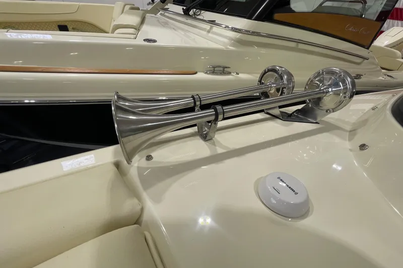 Slide: The Image of 2026 Chris-Craft Launch 31 GT boat with chrome horns and luxurious interior details. - 18
