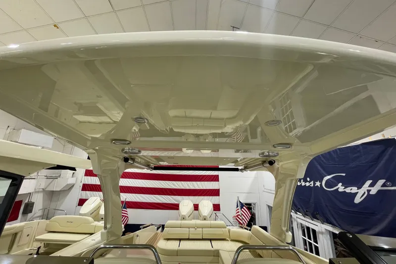 Slide: The Image of 2026 Chris-Craft Launch 31 GT boat interior with sleek design and American flag backdrop. - 19