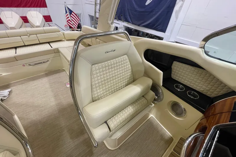 Slide: The Image of Luxurious interior of 2026 Chris-Craft Launch 31 GT boat with elegant seating and American flag. - 20