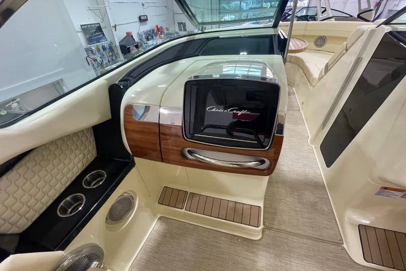 Slide: The Image of 2026 Chris-Craft Launch 31 GT interior with elegant wood and leather accents. - 24