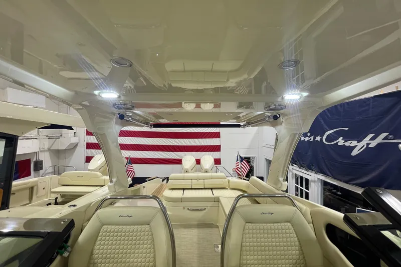 Slide: The Image of 2026 Chris-Craft Launch 31 GT interior with luxurious seating and American flag backdrop. - 28