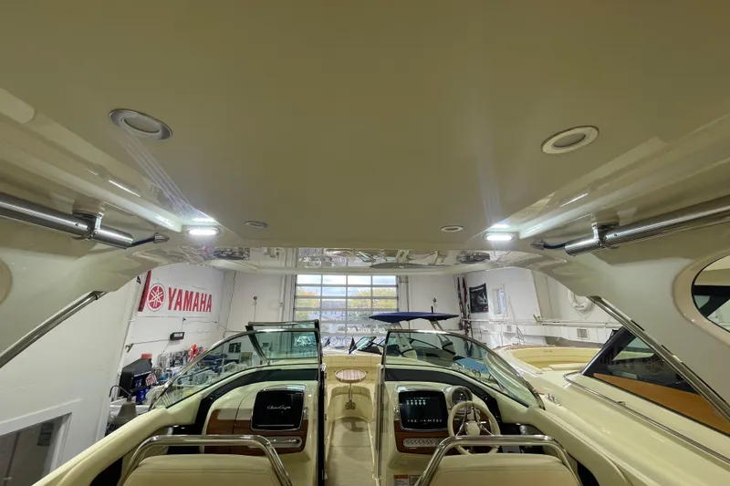 Slide: The Image of 2026 Chris-Craft Launch 31 GT interior view in showroom with Yamaha signage. - 29