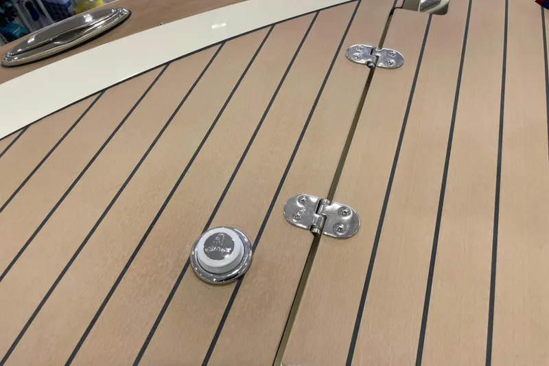 Slide: The Image of Teak deck of 2026 Chris-Craft Launch 31 GT with chrome fittings and hinges. - 3