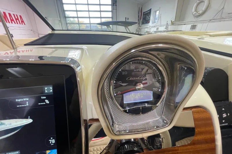 Slide: The Image of 2026 Chris-Craft Launch 31 GT dashboard with speedometer and digital display. - 31