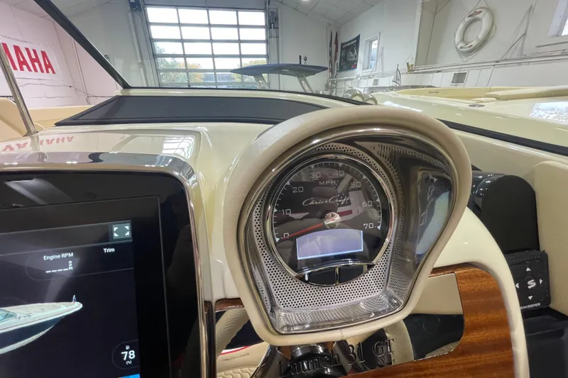 Slide: The Image of Dashboard of 2026 Chris-Craft Launch 31 GT boat with speedometer and digital display. - 32