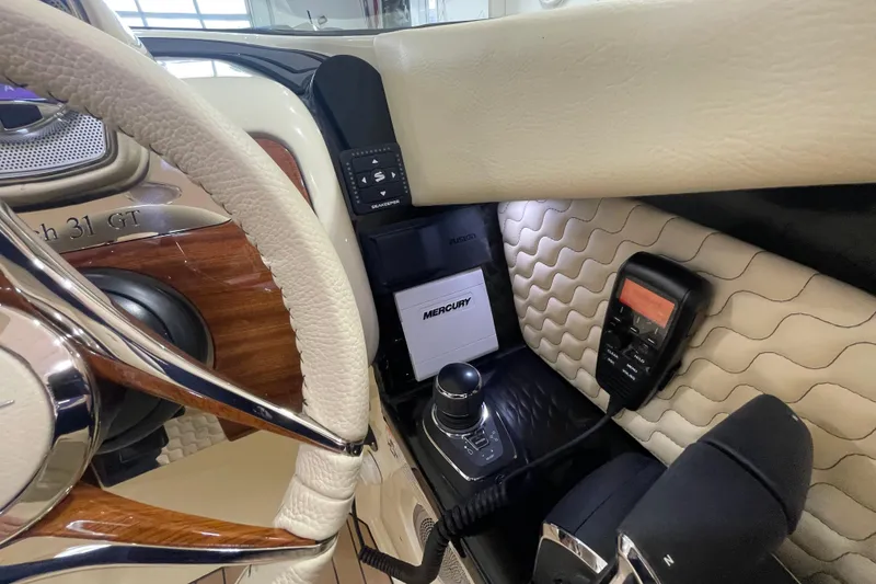 Slide: The Image of Interior of 2026 Chris-Craft Launch 31 GT with steering wheel and control panel. - 33