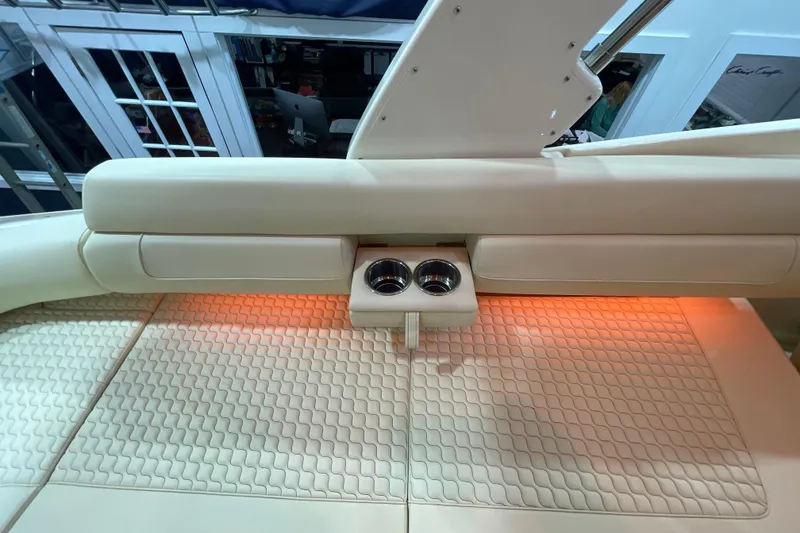Slide: The Image of 2026 Chris-Craft Launch 31 GT interior with beige seating and cup holders. - 46