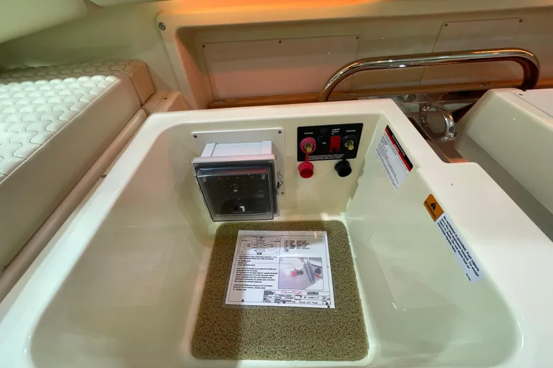 Slide: The Image of 2026 Chris-Craft Launch 31 GT boat interior with control panel and safety instructions. - 47