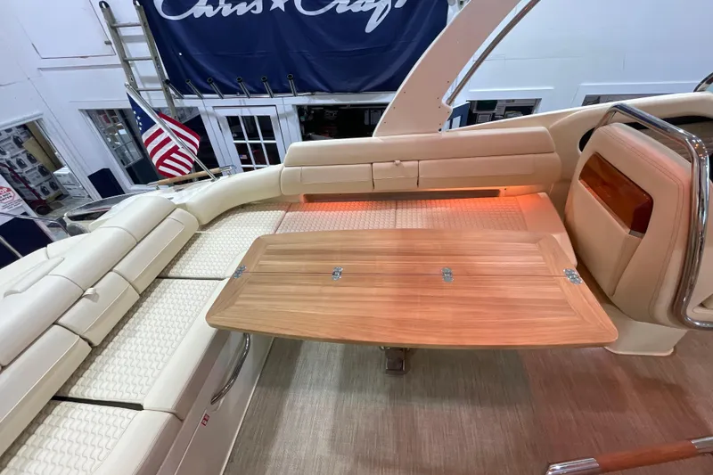 Slide: The Image of 2026 Chris-Craft Launch 31 GT interior with elegant seating and wooden table. - 50