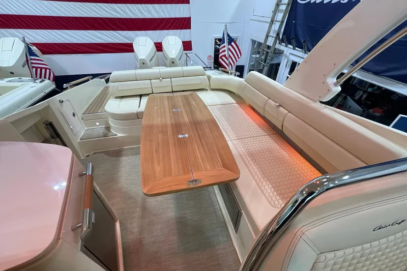 Slide: The Image of 2026 Chris-Craft Launch 31 GT interior with elegant seating and wooden table. - 51