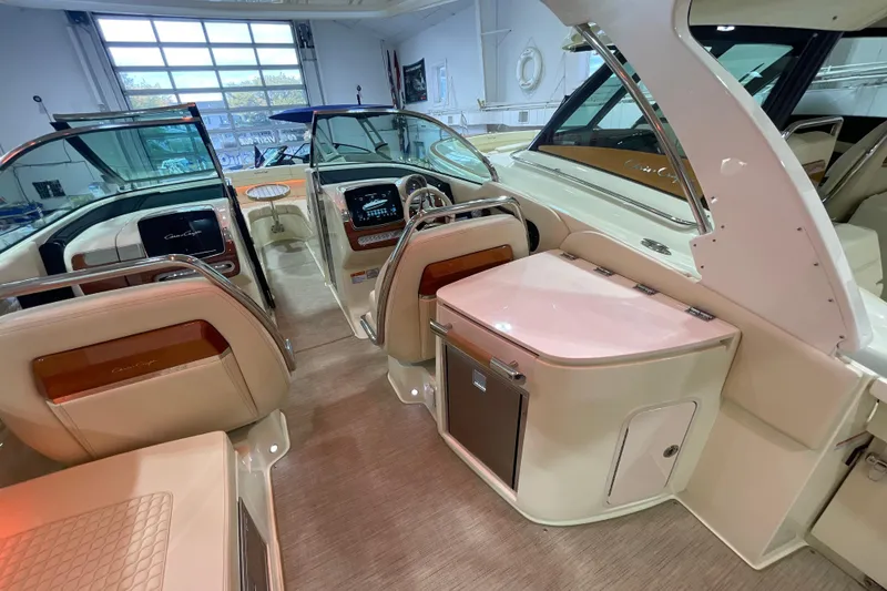 Slide: The Image of 2026 Chris-Craft Launch 31 GT interior showcasing luxurious seating and modern dashboard. - 54