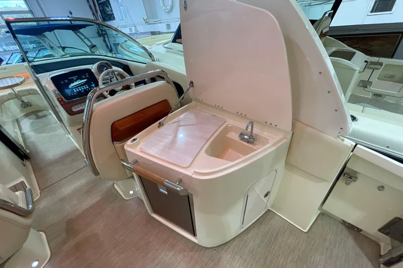 Slide: The Image of 2026 Chris-Craft Launch 31 GT interior with sink and modern dashboard. - 55