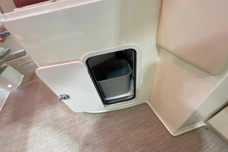 Slide: The Image of 2026 Chris-Craft Launch 31 GT interior storage compartment with open door. - 59