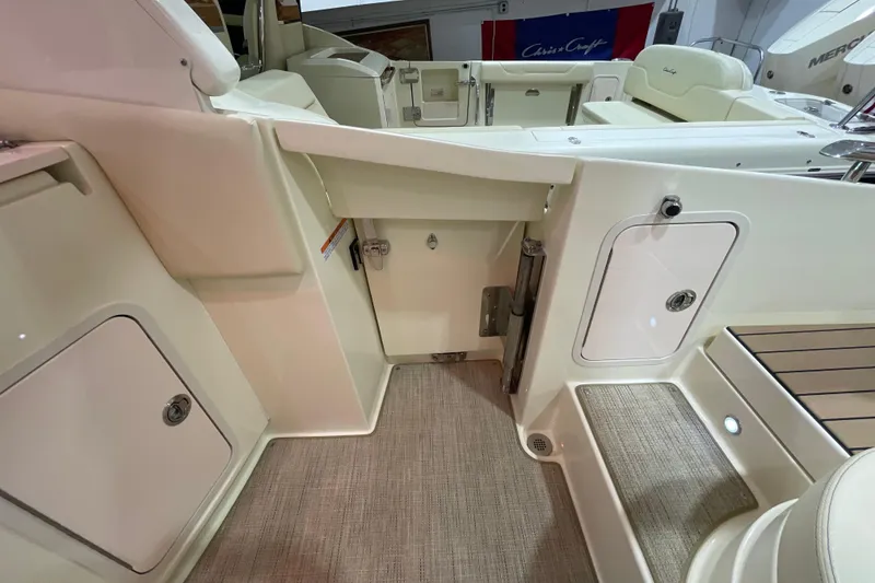 Slide: The Image of 2026 Chris-Craft Launch 31 GT interior, featuring elegant seating and storage compartments. - 60