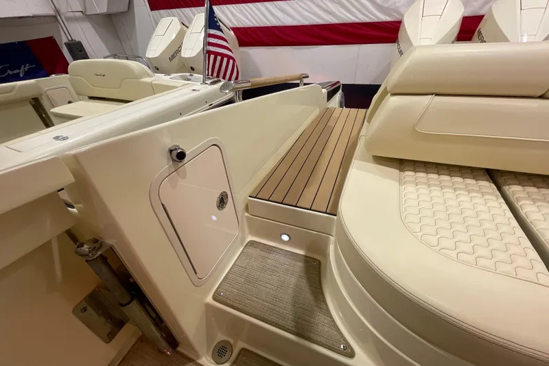 Slide: The Image of 2026 Chris-Craft Launch 31 GT boat interior with elegant seating and American flag. - 62