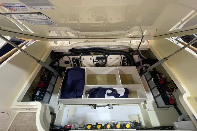 Slide: The Image of 2026 Chris-Craft Launch 31 GT engine compartment with organized storage and visible components. - 73