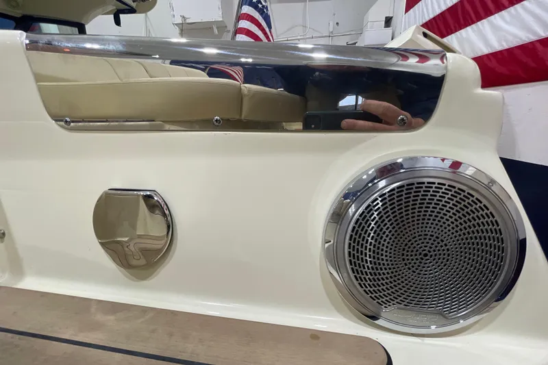 Slide: The Image of 2026 Chris-Craft Launch 31 GT boat interior with speaker and American flag detail. - 76