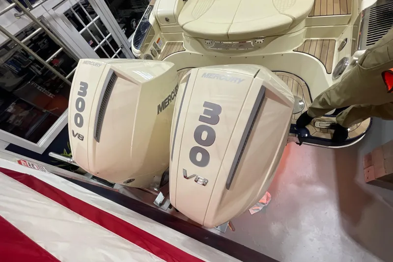 Slide: The Image of 2026 Chris-Craft Launch 31 GT with dual Mercury 300 V8 engines, docked indoors. - 78