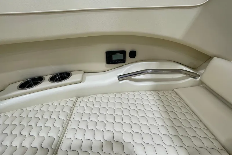 Slide: The Image of 2026 Chris-Craft Launch 31 GT interior with quilted seating, cup holders, and control panel. - 8