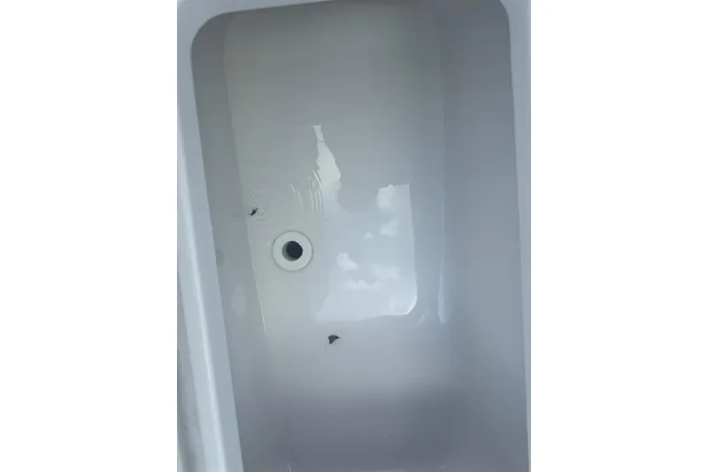 Slide: The Image of White interior compartment of 2025 Sportsman Masters 267OE Bay Boat. - 9