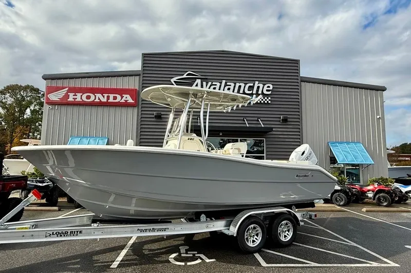 The Image of 2026 Bulls Bay 230 Center Console boat on trailer outside dealership. - 0