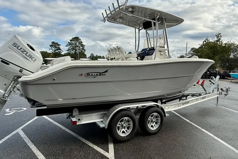 Slide: The Image of 2026 Bulls Bay 230 Center Console boat on trailer with Suzuki outboard motor. - 3